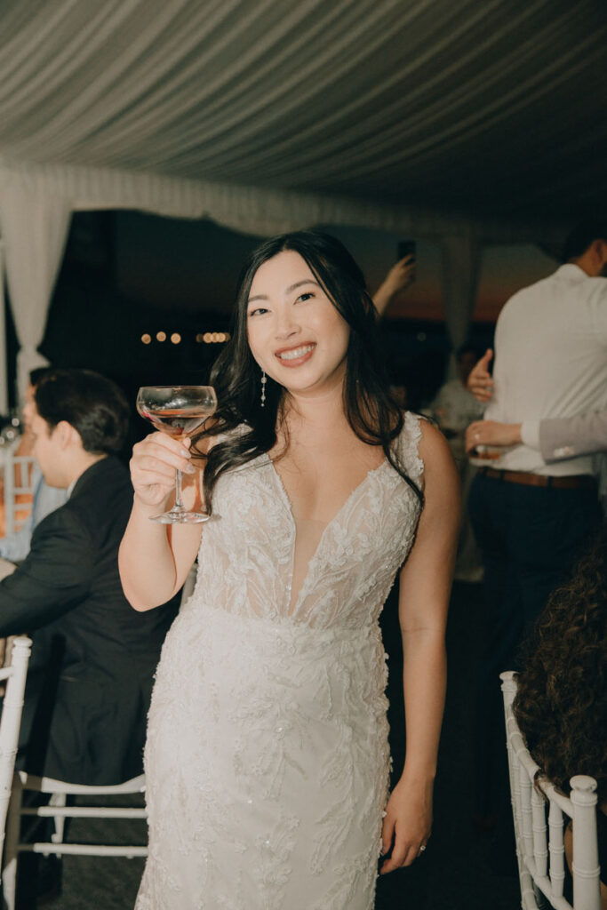bride holding a glass of champagne