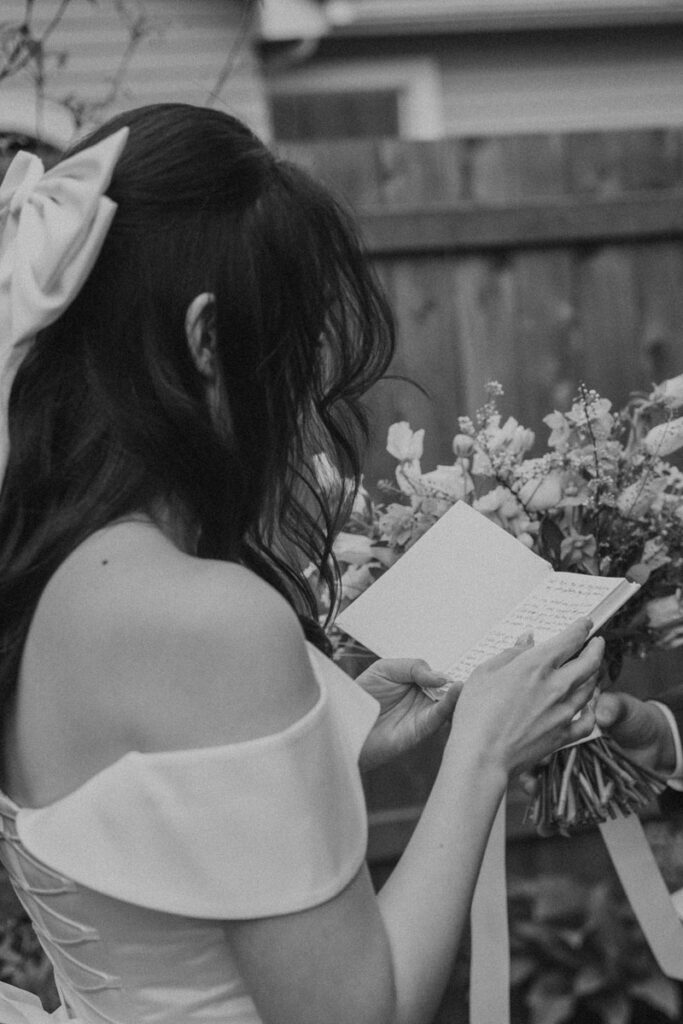 bride reading vow book