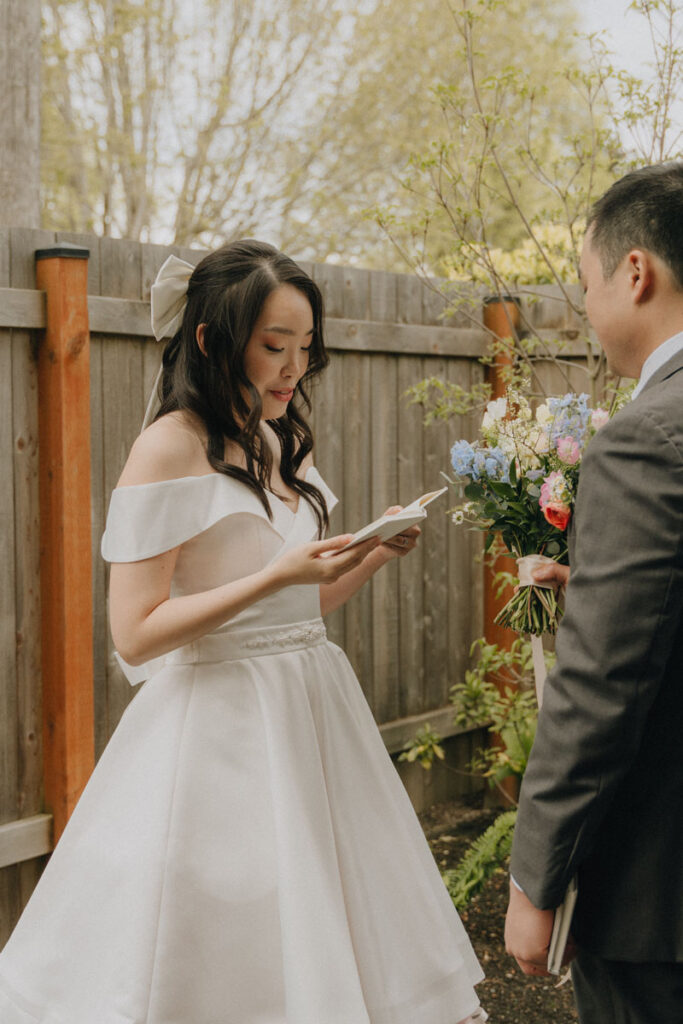 bride reading her vows to her husband