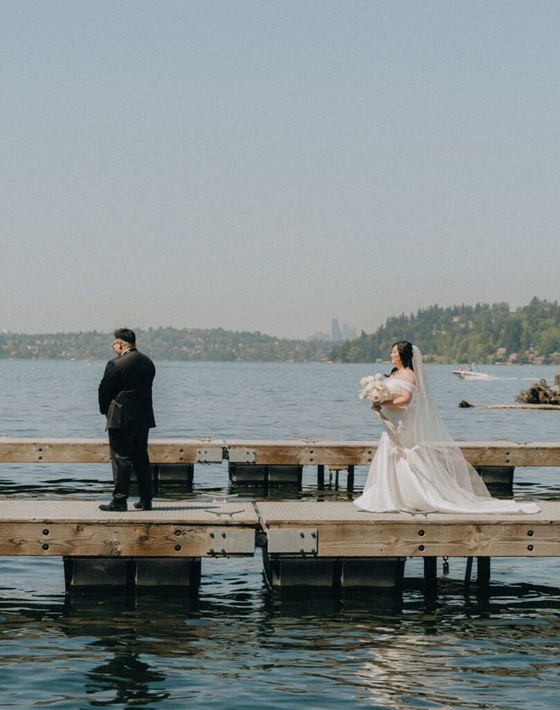 couple doing first look on a dock