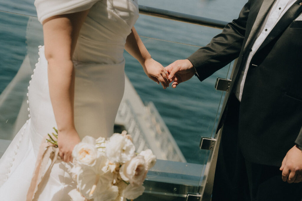 bride and groom holding hands